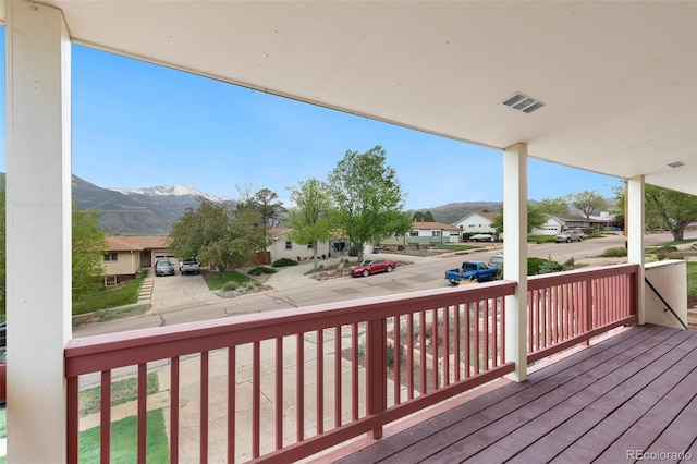 813 Panorama Dr, Colorado Springs, CO 80904 - wooden porch featuring a residential view and a mountain view