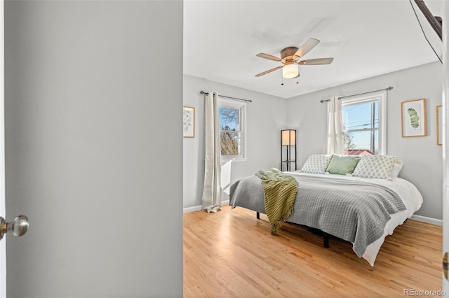 bedroom featuring ceiling fan and light wood-type flooring