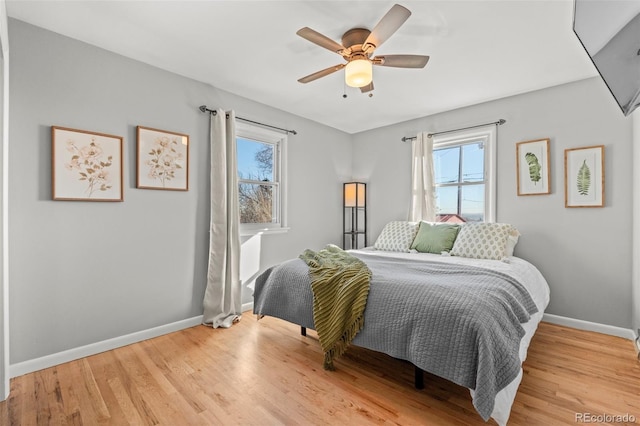 bedroom featuring ceiling fan and light hardwood / wood-style flooring