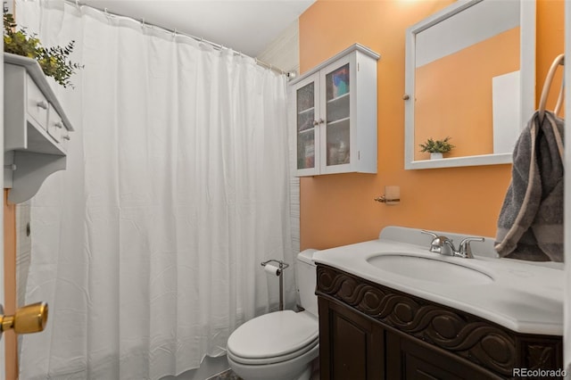 bathroom featuring toilet and vanity