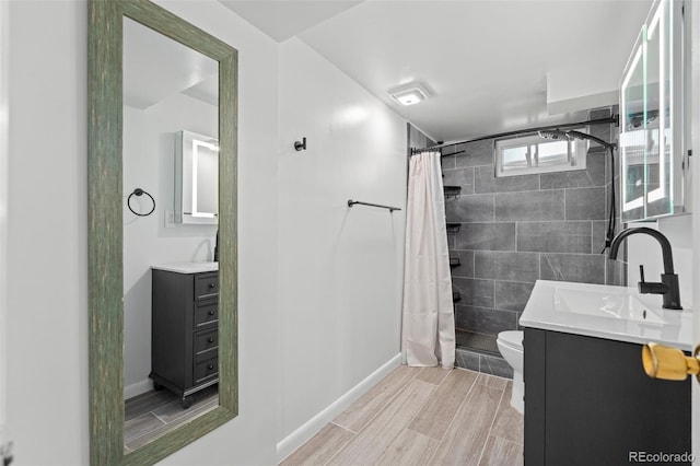 bathroom featuring toilet, a shower with shower curtain, and vanity