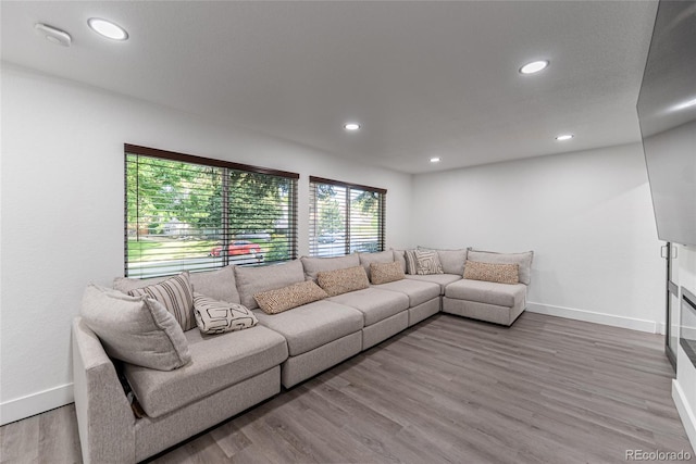 7302 E Bates Dr, Denver, CO 80231 - living room featuring wood finished floors and recessed lighting