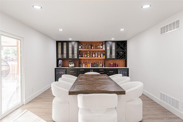 7302 E Bates Dr, Denver, CO 80231 - indoor dry bar featuring beverage cooler, recessed lighting, and light wood-style flooring