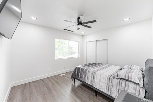 7302 E Bates Dr, Denver, CO 80231 - bedroom with wood finished floors, a closet, recessed lighting, and a ceiling fan