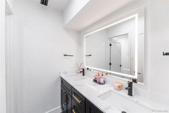 7302 E Bates Dr, Denver, CO 80231 - bathroom with double vanity