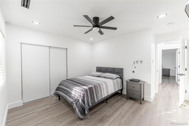 7302 E Bates Dr, Denver, CO 80231 - bedroom featuring light wood-style floors, a closet, recessed lighting, and ceiling fan