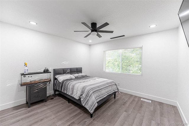 7302 E Bates Dr, Denver, CO 80231 - bedroom with light wood-style flooring, recessed lighting, and a ceiling fan