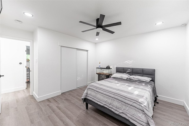 7302 E Bates Dr, Denver, CO 80231 - bedroom with wood finished floors, a closet, recessed lighting, and a ceiling fan
