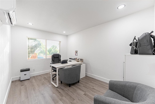 7302 E Bates Dr, Denver, CO 80231 - home office featuring light wood-type flooring, a wall unit AC, and recessed lighting
