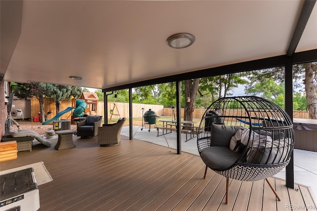 7302 E Bates Dr, Denver, CO 80231 - deck featuring a playground, a fenced backyard, and a patio area