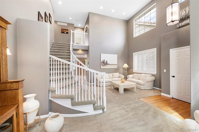 10633 Wynspire Way, Highlands Ranch, CO 80130 - stairs featuring carpet flooring, a high ceiling, and recessed lighting
