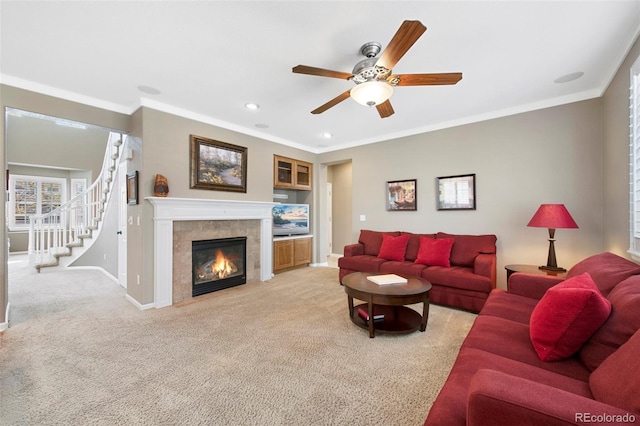 10633 Wynspire Way, Highlands Ranch, CO 80130 - living area featuring a ceiling fan, a fireplace, light carpet, recessed lighting, and crown molding