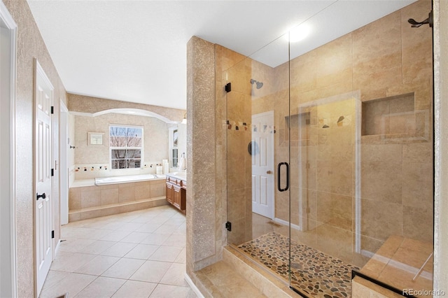 10633 Wynspire Way, Highlands Ranch, CO 80130 - bathroom with a garden tub, a stall shower, vanity, and tile patterned flooring