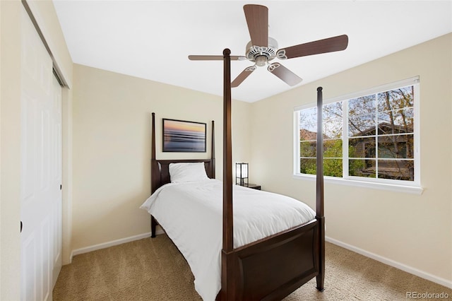 10633 Wynspire Way, Highlands Ranch, CO 80130 - bedroom with light colored carpet, a closet, and a ceiling fan