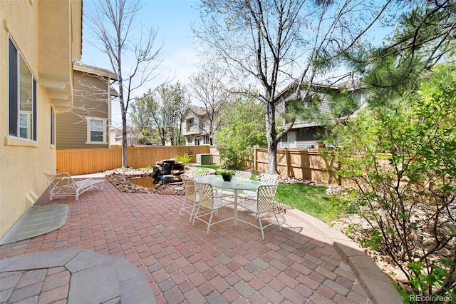 10633 Wynspire Way, Highlands Ranch, CO 80130 - fenced backyard with outdoor dining space and a patio area