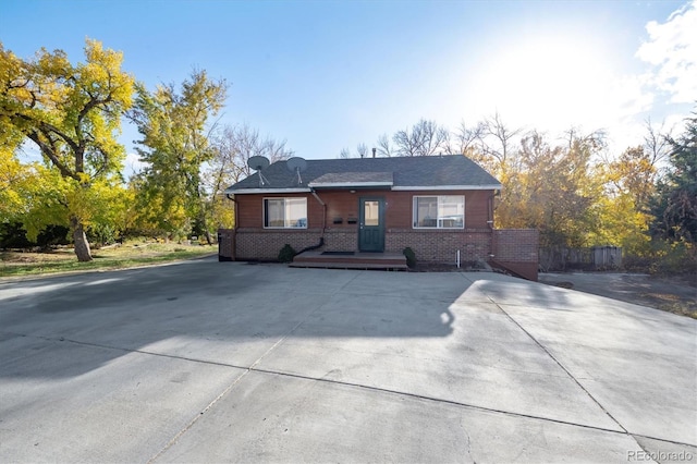 3900 Turnpike Dr, Westminster, CO 80030 - view of front facade with brick siding and driveway