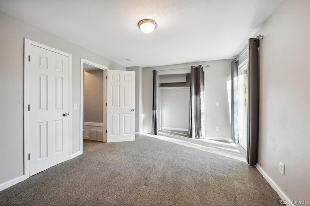 3900 Turnpike Dr, Westminster, CO 80030 - unfurnished bedroom with a closet, carpet flooring, baseboards, and visible vents