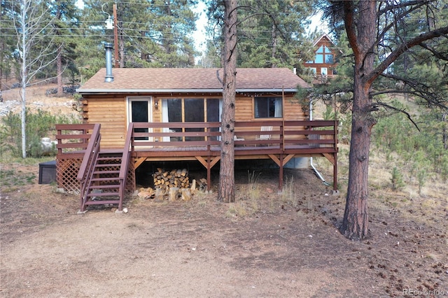 rear view of house with a deck