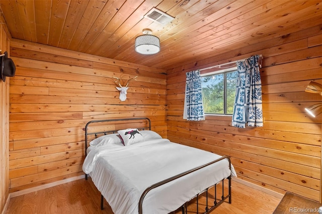 339 Hall Rd, Bailey, CO 80421 - bedroom with wood ceiling, wood finished floors, and wooden walls