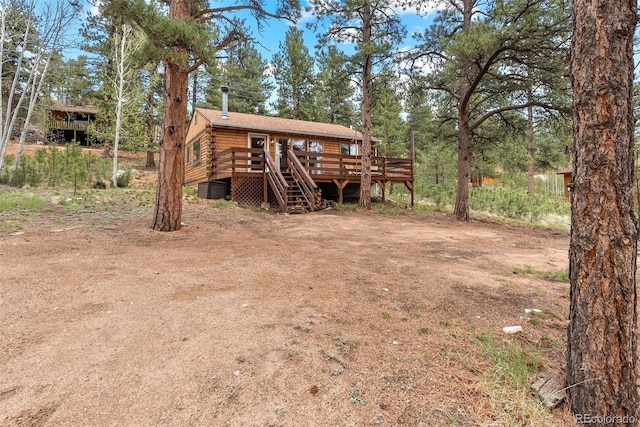339 Hall Rd, Bailey, CO 80421 - rear view of house with log exterior and a wooden deck