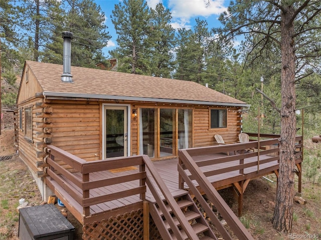 339 Hall Rd, Bailey, CO 80421 - rear view of house with log exterior, roof with shingles, and a wooden deck