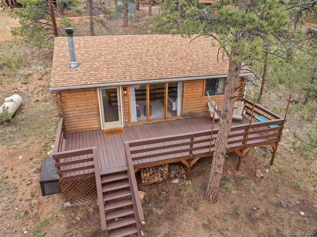 339 Hall Rd, Bailey, CO 80421 - back of property with roof with shingles and a wooden deck