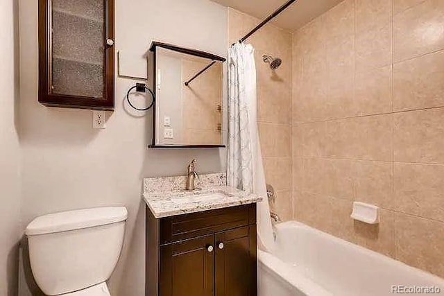 1365 Clayton St, Denver, CO 80206 - bathroom with vanity, shower / bath combo with shower curtain, and toilet