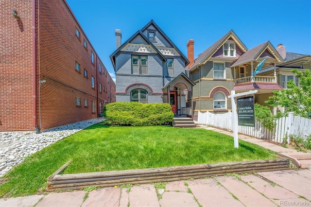 1365 Clayton St, Denver, CO 80206 - victorian-style house with brick siding