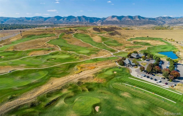 birds eye view of property with a water and mountain view