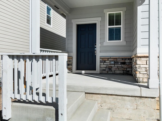 entrance to property with covered porch