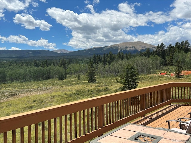 wooden terrace featuring a mountain view