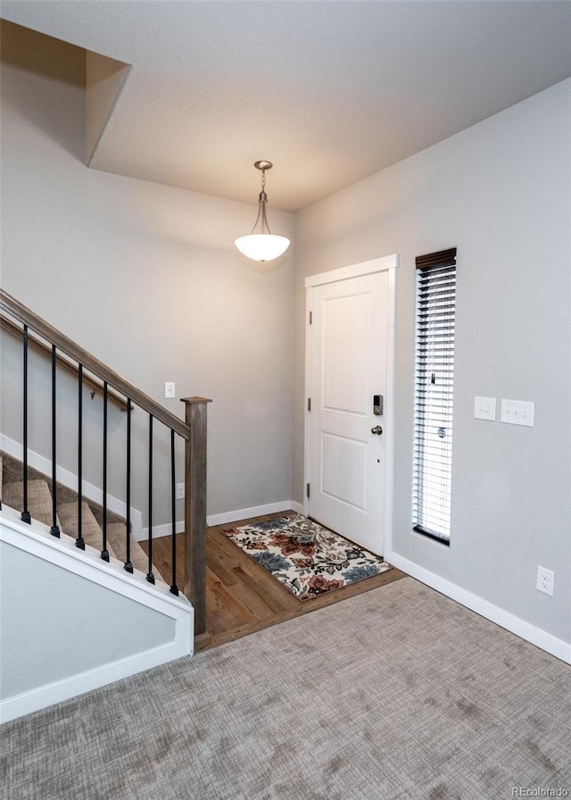 entryway with carpet floors