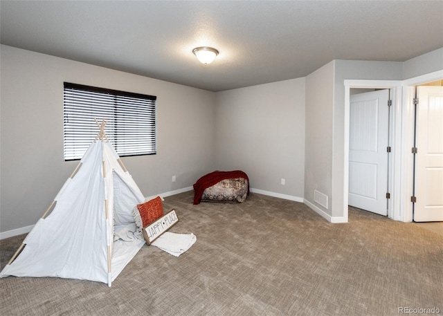 game room with light colored carpet