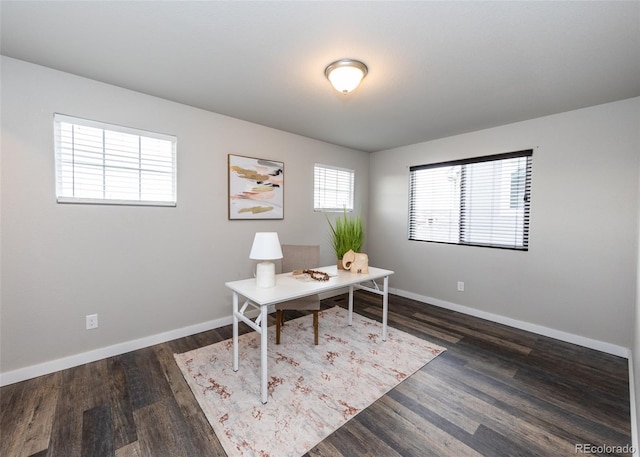 office with dark hardwood / wood-style flooring