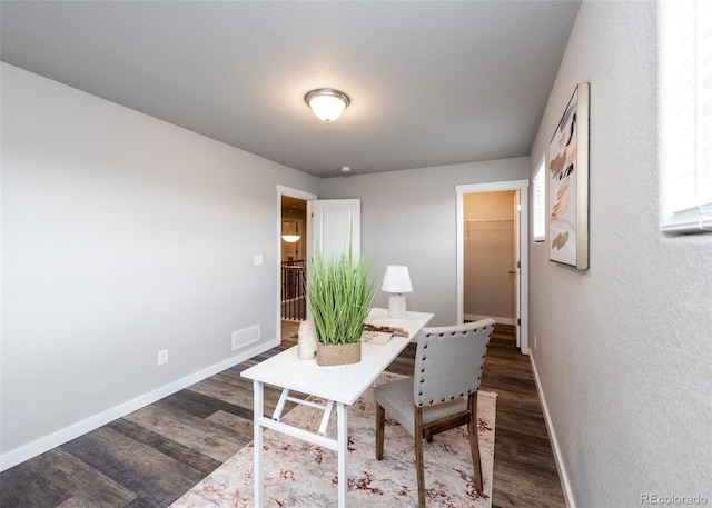 office with dark hardwood / wood-style floors