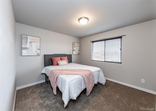 bedroom featuring dark colored carpet