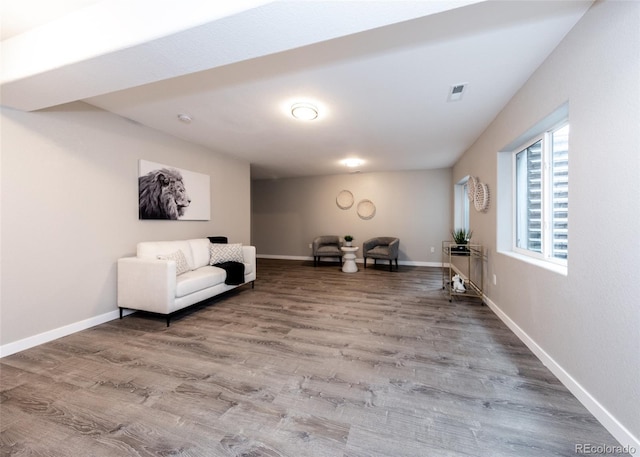 living area featuring hardwood / wood-style floors