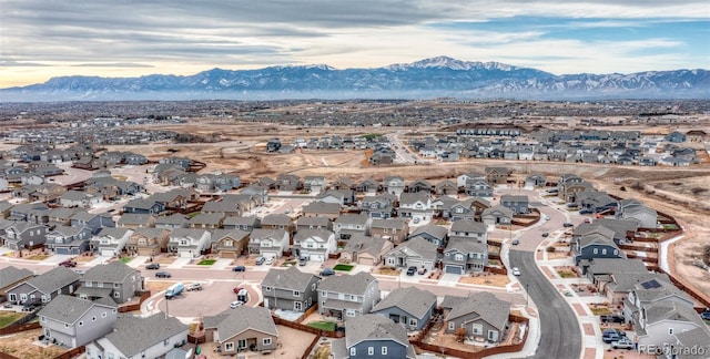 birds eye view of property with a mountain view