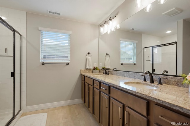 16461 E 119th Way Unit B, Commerce City, CO 80022 - full bathroom featuring double vanity, a shower stall, and tile patterned flooring