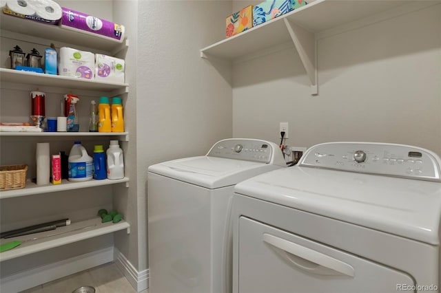 16461 E 119th Way Unit B, Commerce City, CO 80022 - washroom featuring washer and clothes dryer and tile patterned floors