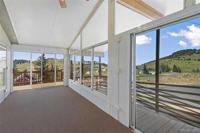 235 W May St, Cripple Creek, CO 80813 - unfurnished sunroom with carpet floors, a mountain view, and a ceiling fan