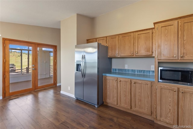 235 W May St, Cripple Creek, CO 80813 - kitchen with stainless steel appliances, french doors, dark wood finished floors, and brown cabinets