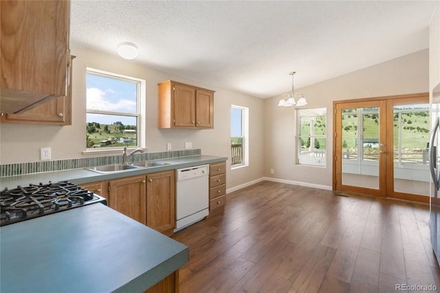 235 W May St, Cripple Creek, CO 80813 - kitchen with white dishwasher, vaulted ceiling, a chandelier, pendant lighting, and dark wood-style floors