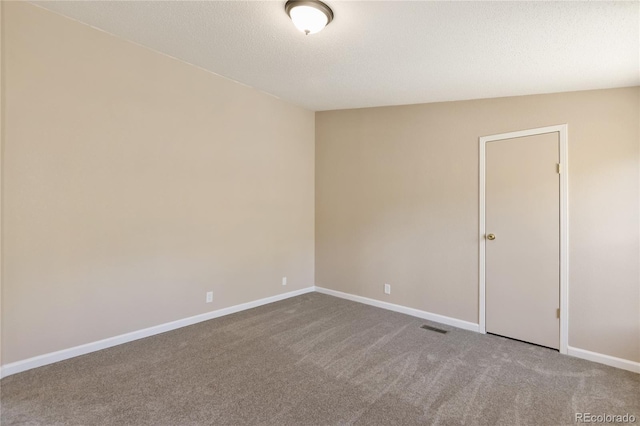 235 W May St, Cripple Creek, CO 80813 - carpeted spare room with baseboards and a textured ceiling
