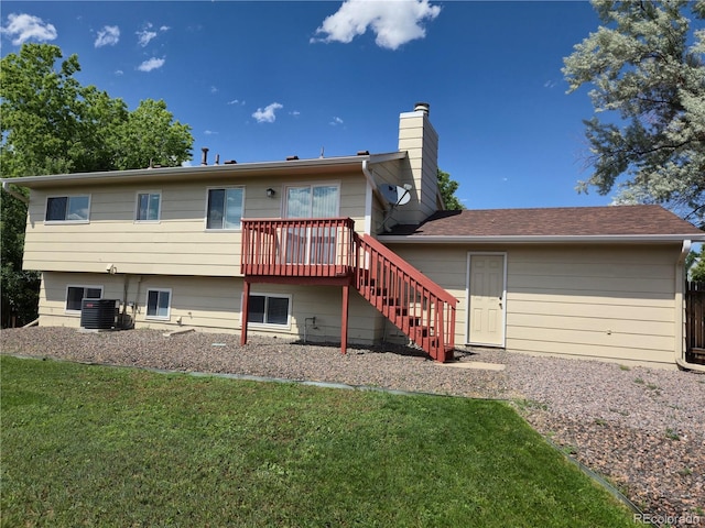 1265 S Biscay St, Aurora, CO 80017 - rear view of property featuring stairway, a lawn, a chimney, and a wooden deck