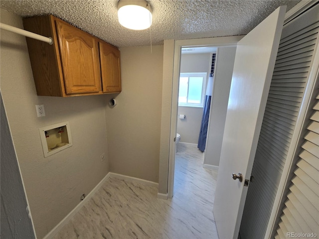 1265 S Biscay St, Aurora, CO 80017 - laundry room featuring hookup for a washing machine, cabinet space, and a textured ceiling