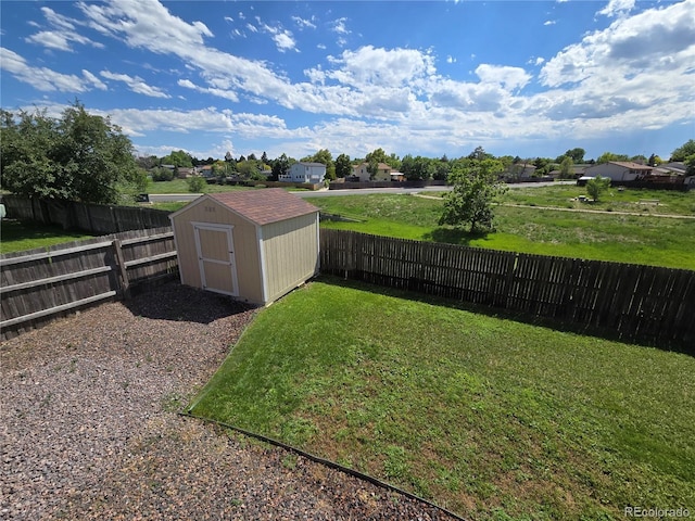 1265 S Biscay St, Aurora, CO 80017 - fenced backyard featuring a storage unit