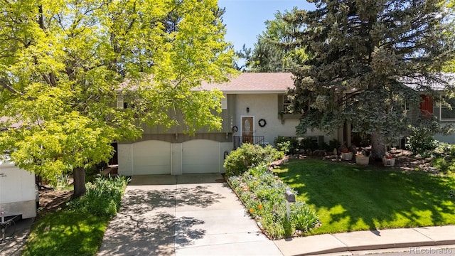 1560 Findlay Way, Boulder, CO 80305 - view of front facade featuring driveway, a front yard, an attached garage, and stucco siding