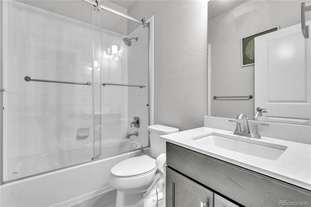 full bathroom featuring shower / bath combination with glass door, toilet, and vanity