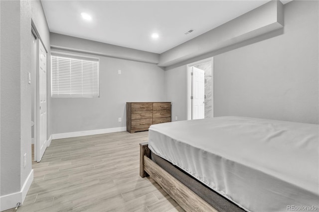 bedroom with light hardwood / wood-style floors